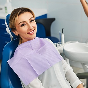 Patient smiling at dentist sitting in treatment chair