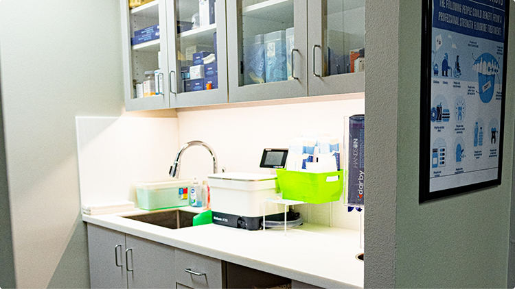 Sink below storage cabinets